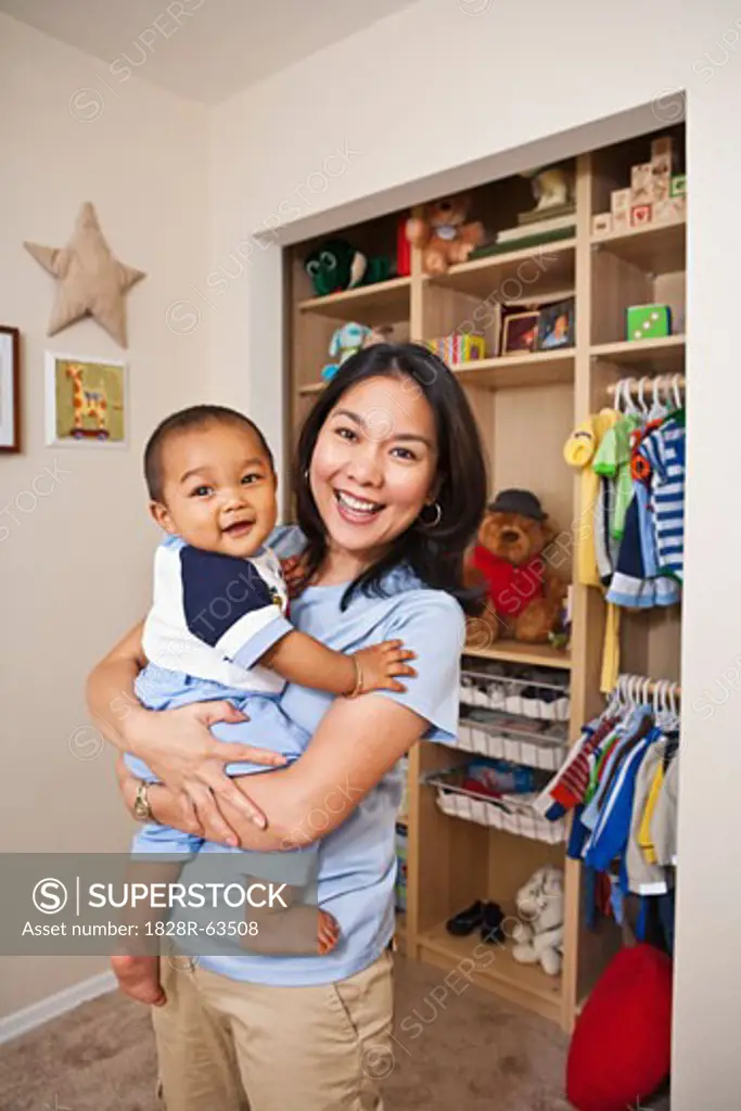 Mother Holding Baby in Nursery