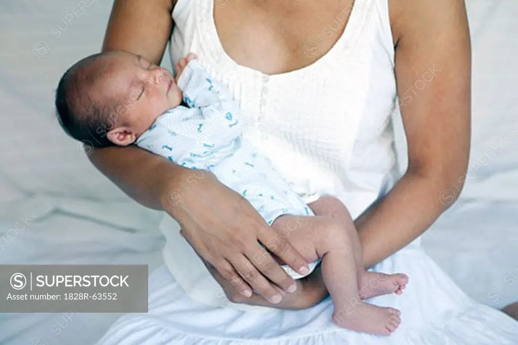 Mother Holding Sleeping Newborn Baby