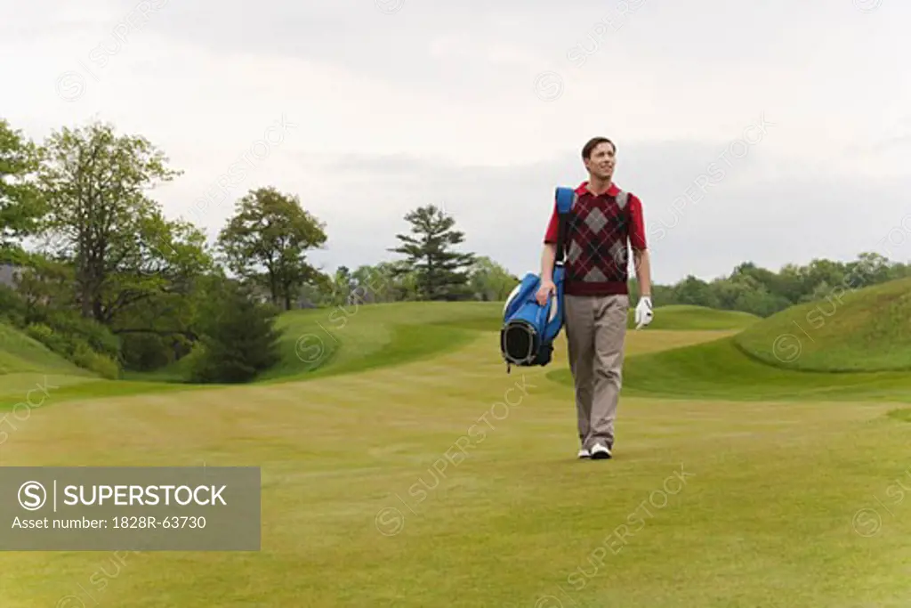 Man Walking on Golf Course