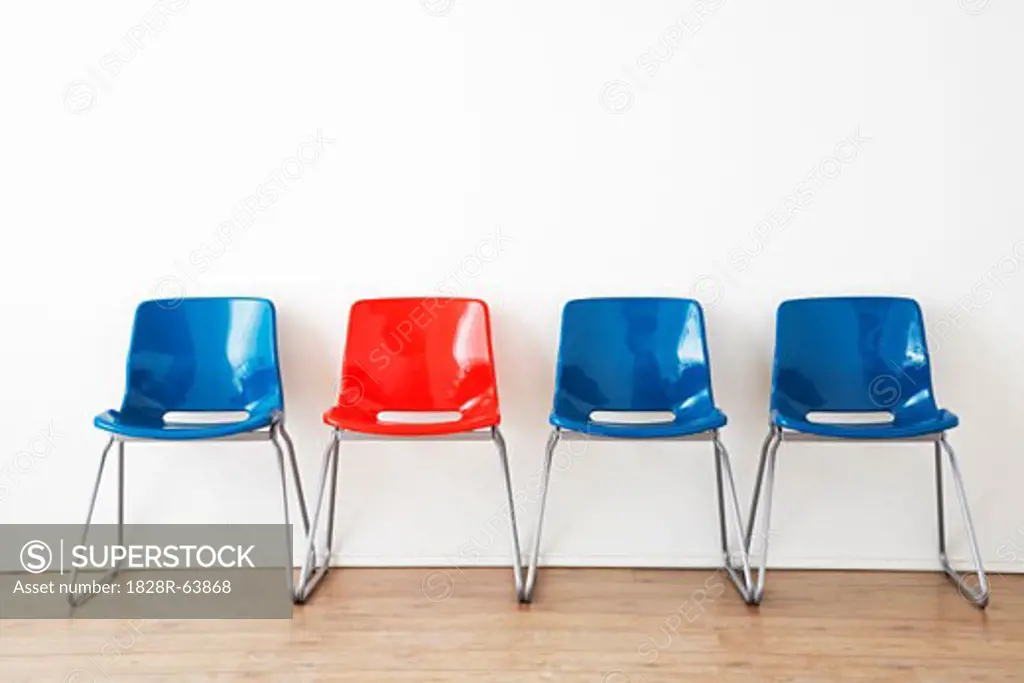 Row of Red and Blue Chairs in Waiting Room