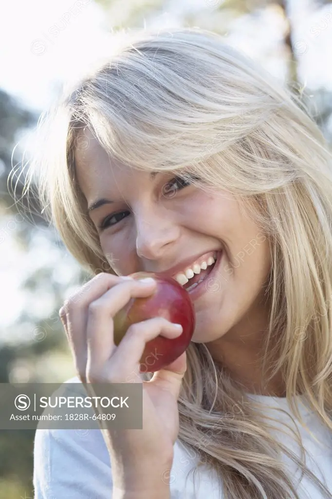 Woman Eating an Apple