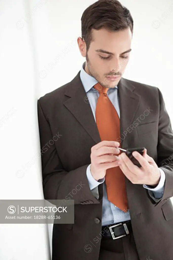 Businessman Using Electronic Organizer