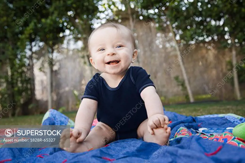 Baby Sitting on Blanket Outside