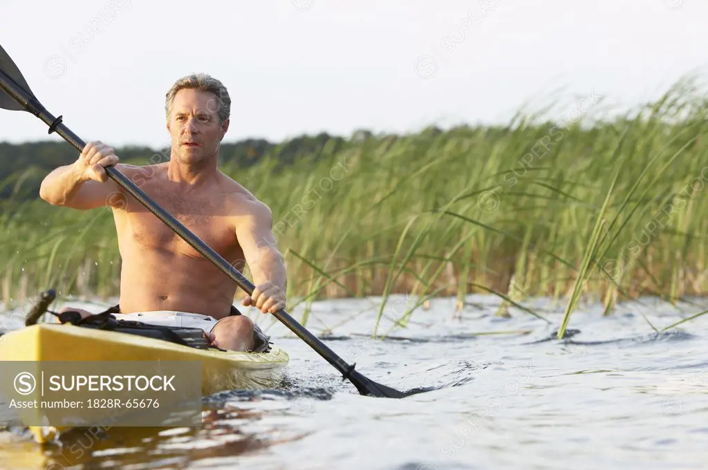Man Kayaking on River, Florida, USA