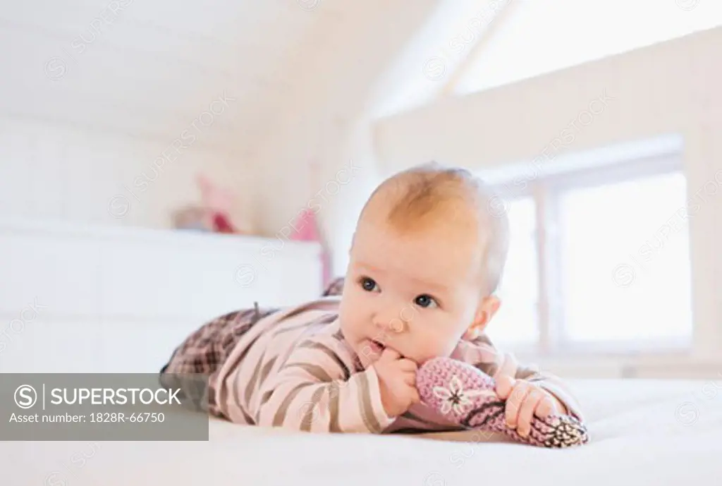 Baby Lying on Bed