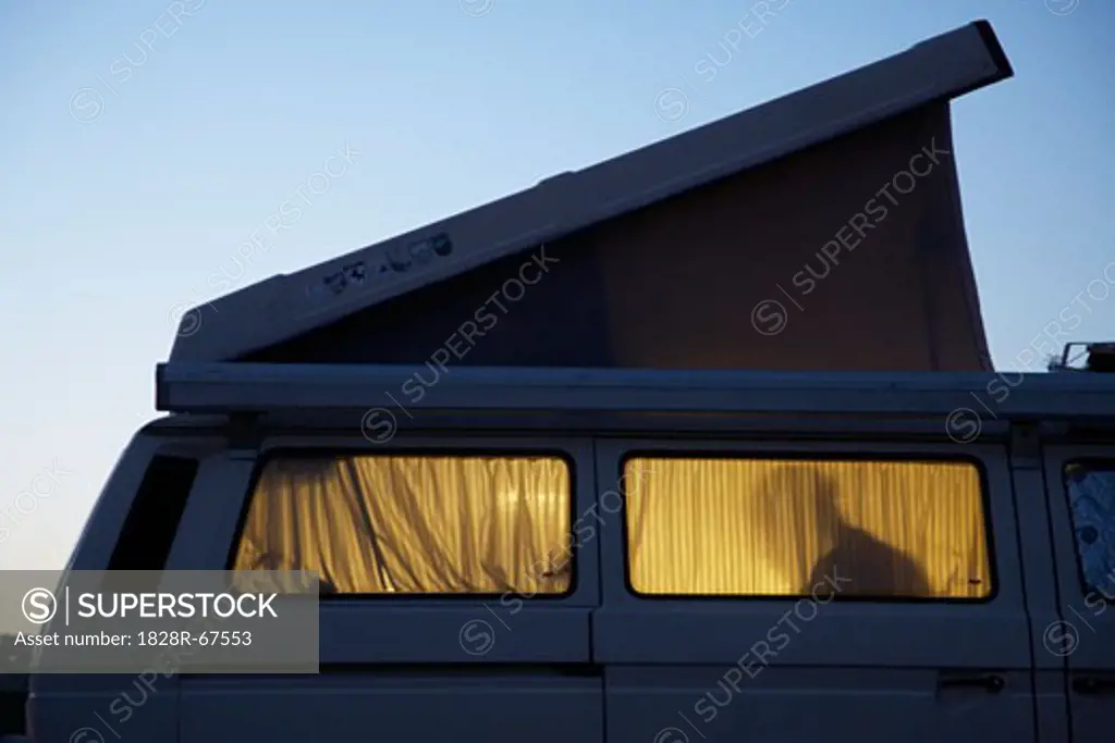 Silhouette of Person Inside Camper