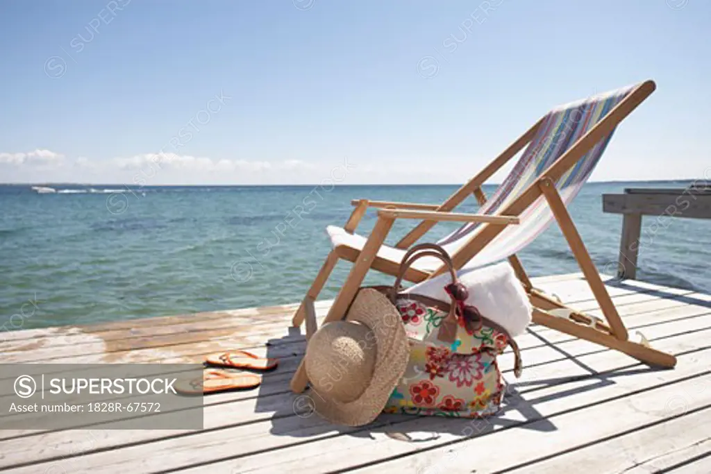 Chair, Hat, Flip Flops and Bag on Dock