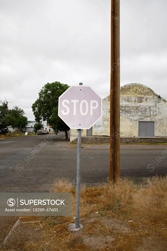 Faded Stop Sign at Corner, Marfa, Presidio County, West Texas, Texas, USA