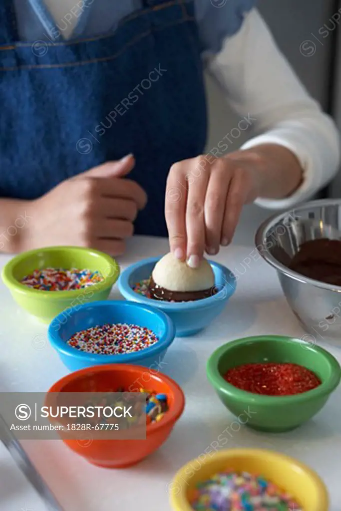 Woman Dipping Shortbread into Chocolate and Sprinkles