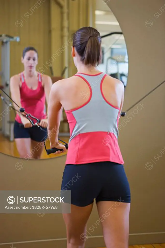 Woman doing Upper Body Exercises in Gym, Seattle, Washington, USA