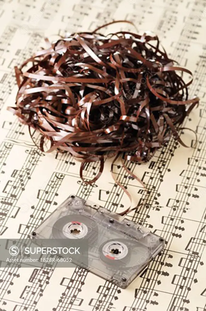 Unravelled Cassette Tape on Sheet Music
