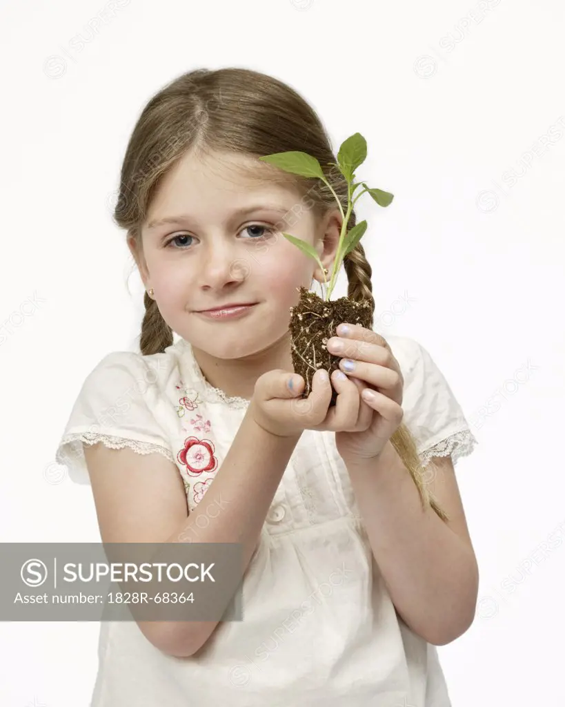 Girl Holding Sapling