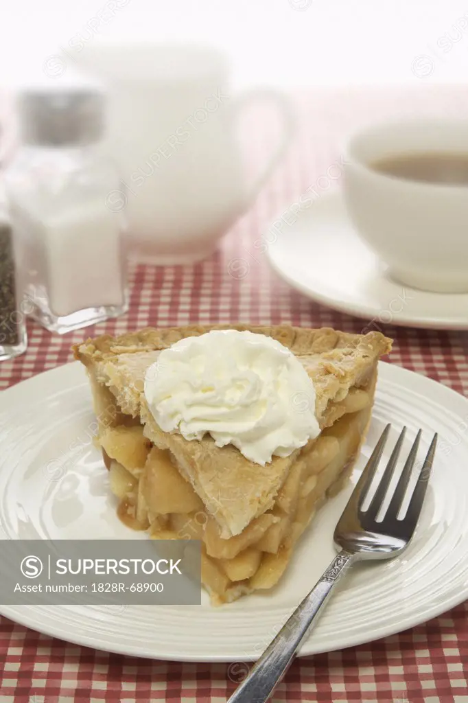 Apple Pie with Whipped Cream on Plate