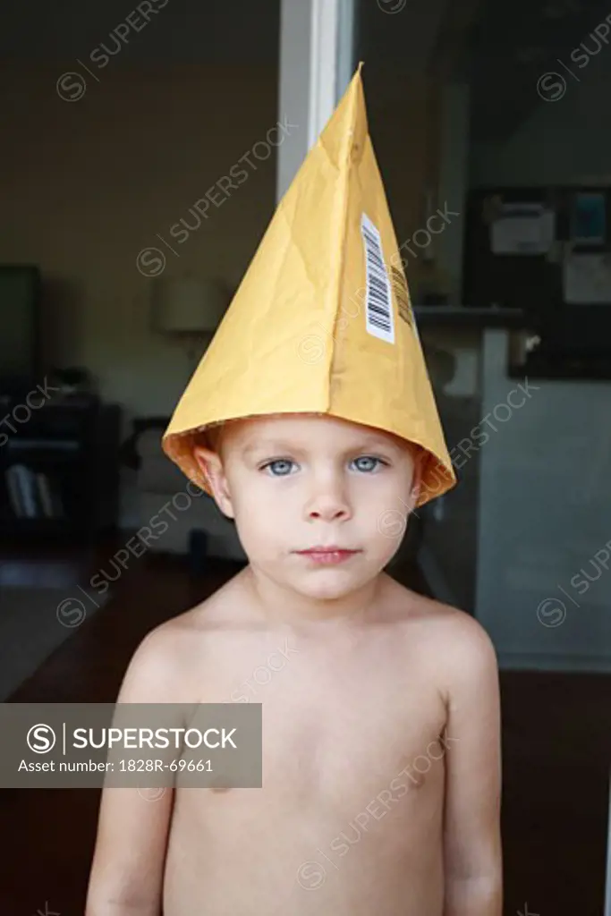 Portrait of Little Boy Wearing Envelope as a Hat