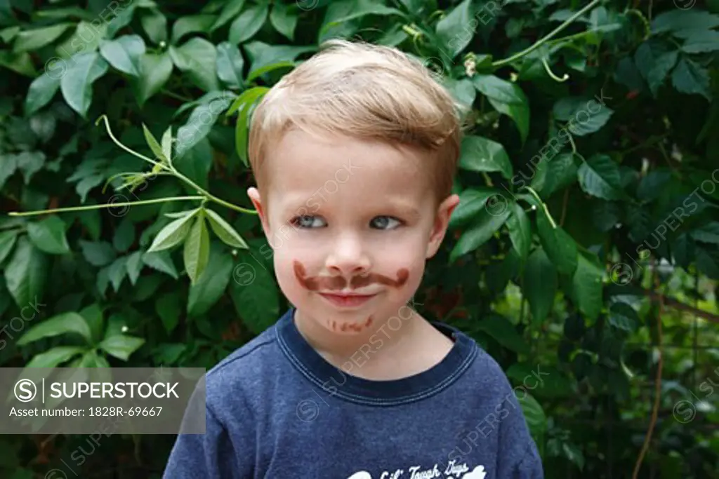 Portrait of Little Boy With Fake Moustache
