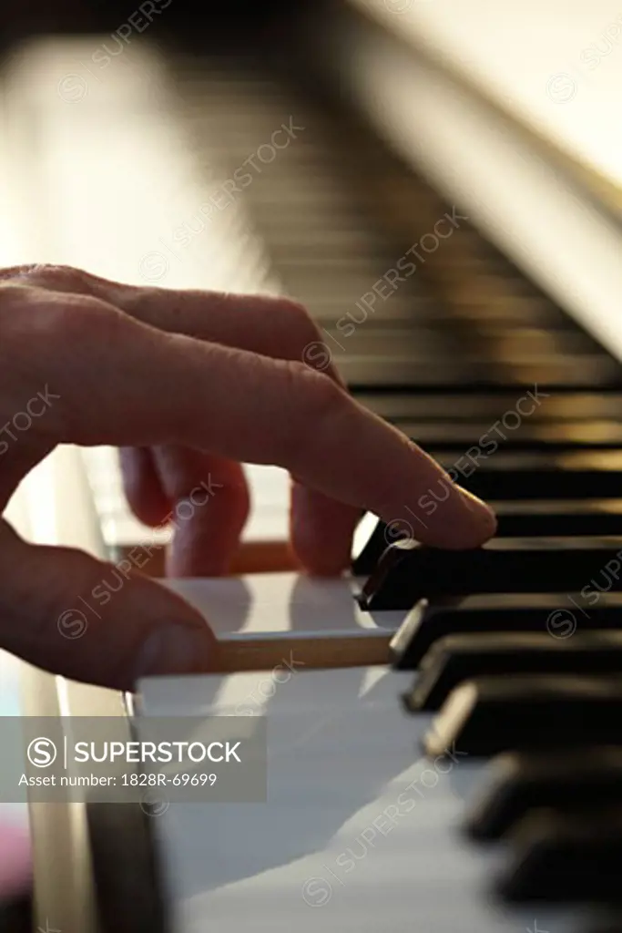 Close-up of Man Playing Piano