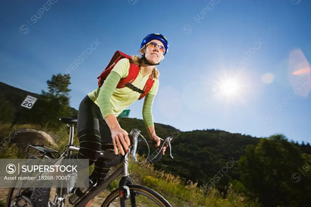 Woman Riding Bicycle, Steamboat Springs, Routt County, Colorado, USA