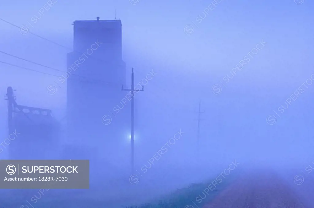 Foggy Dawn, Grain Elevator on Highway #5, near Grandview, Manitoba, Canada   