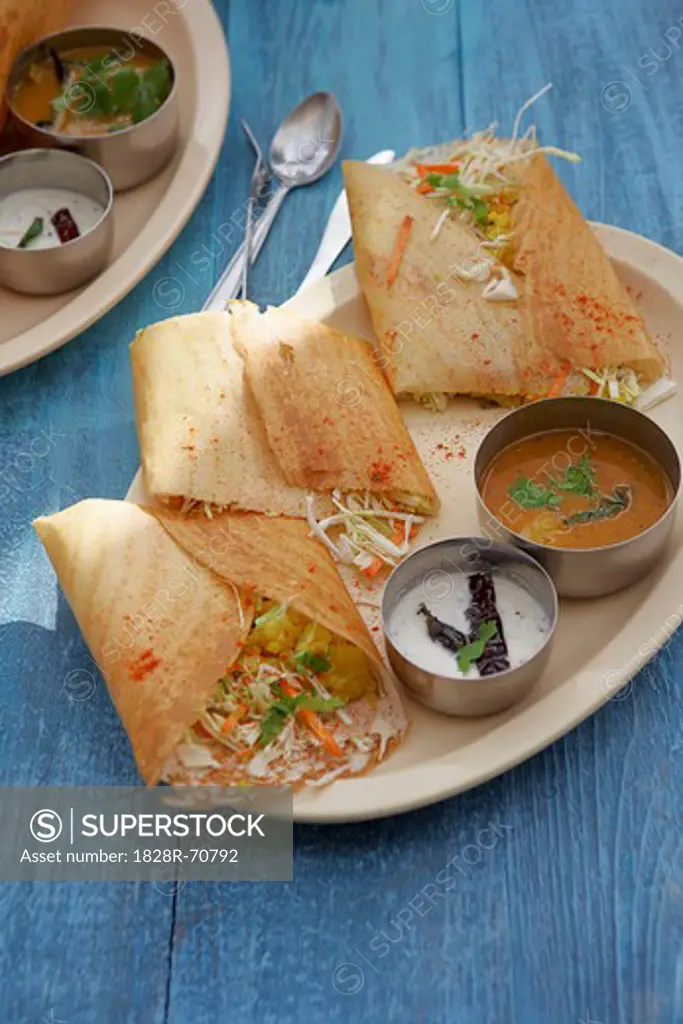 Dosa Filled With Curried Potato, Coconut Chutney, and Sambhar