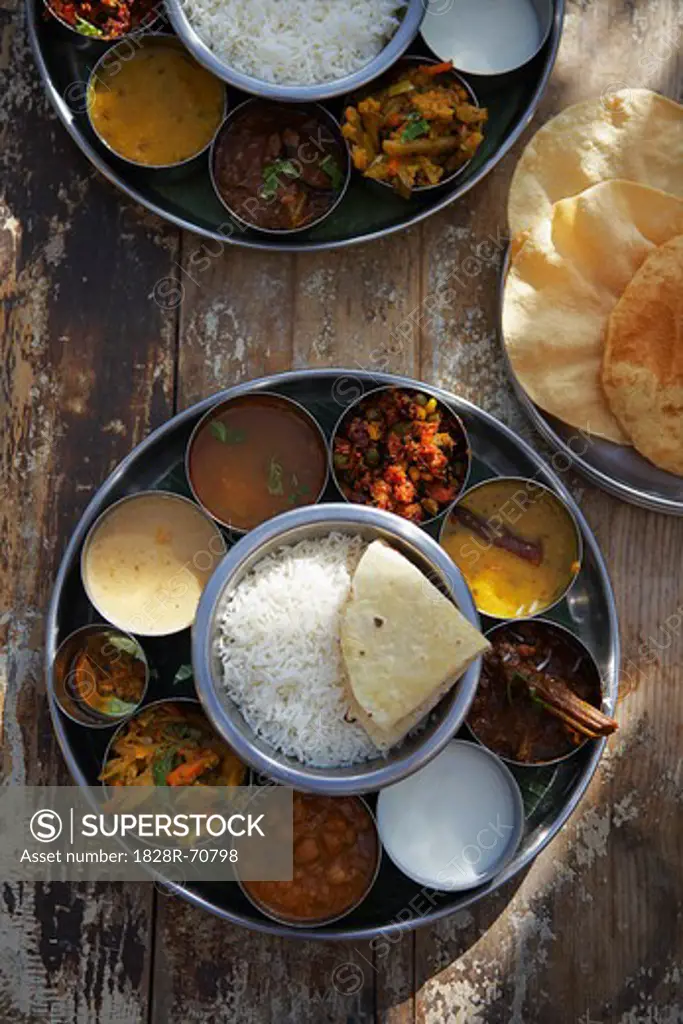 Thali, Rasam, Chana Masala, Kadai Bhindi, Mixed Vegetable Curry, Sambhar, Saag Paneer, Payasam, and Mixed Pickle