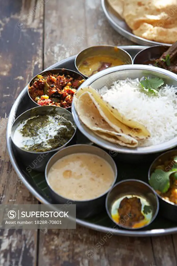 Thali, Kadai Bhindi, Mixed Vegetable Curry, Sambhar, Saag Paneer, Payasam, Mixed Pickle, and Chapati