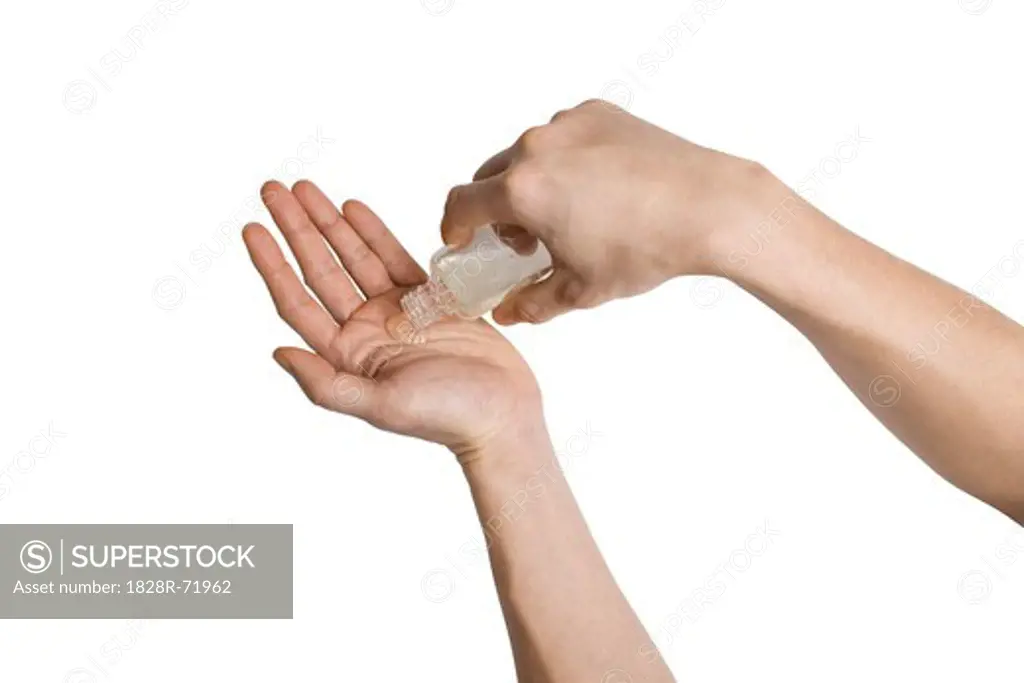Person Using Hand Sanitizer