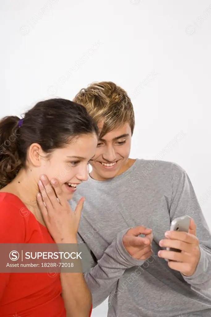 Teenage Girl and Boy with Cell Phone