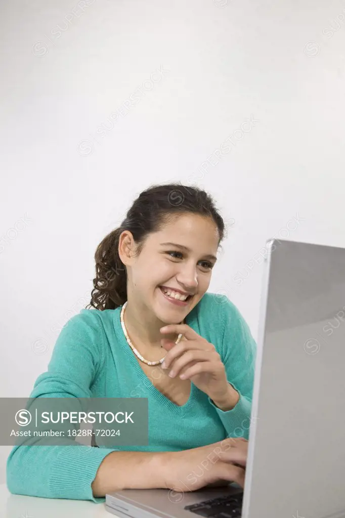 Teenage Girl Using Laptop