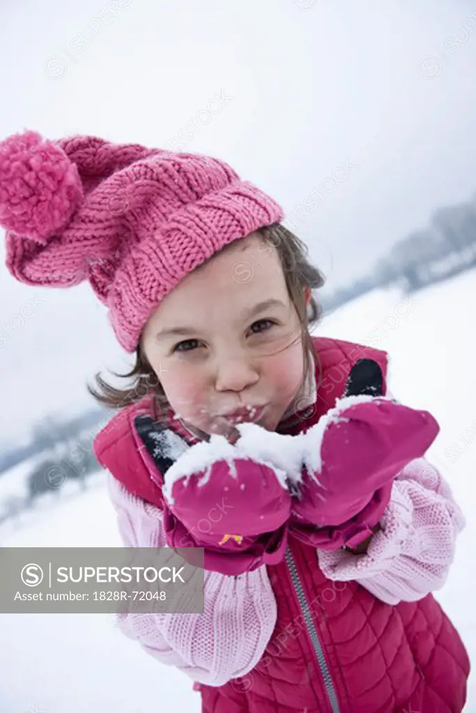 Girl Holding Snow in Hands