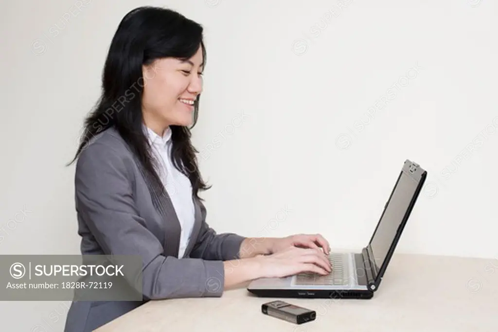 Businesswoman Using Laptop Computer