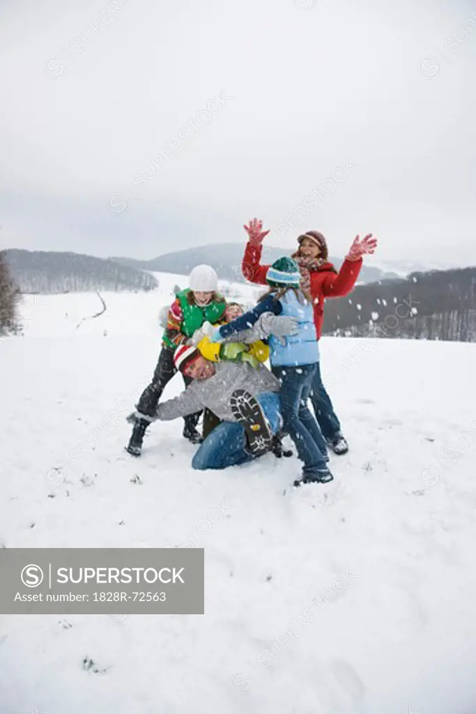 Family Playing in Snow