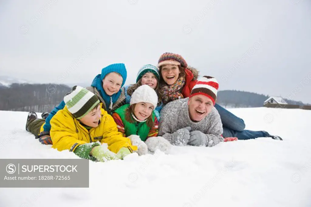 Portrait of Family Playing in Snow