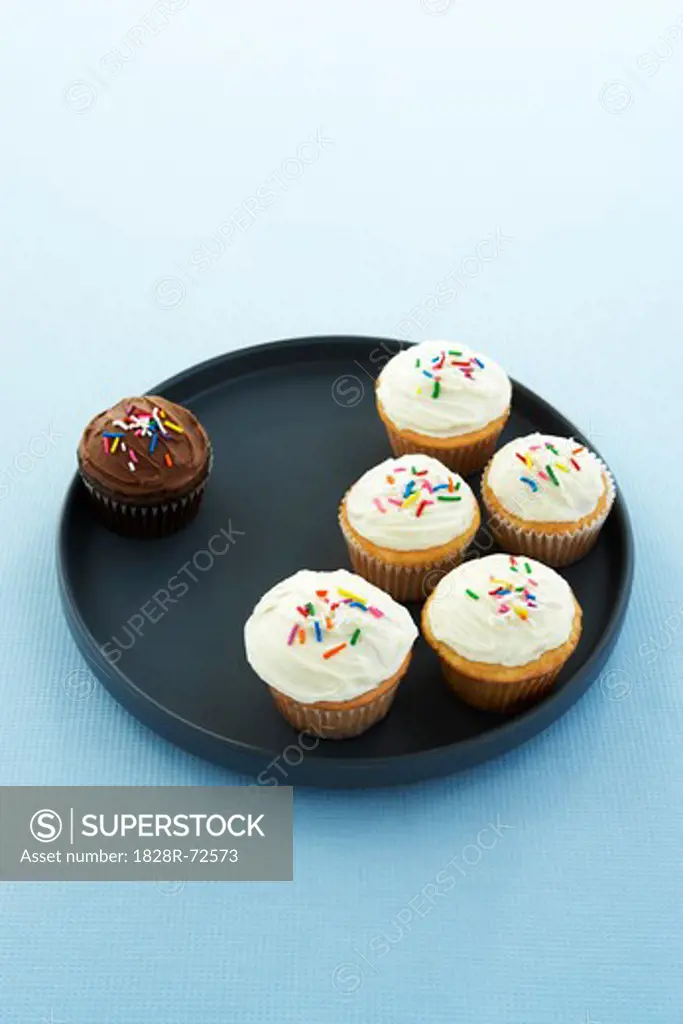 Chocolate Cupcake Seperated from Vanilla Cupcakes