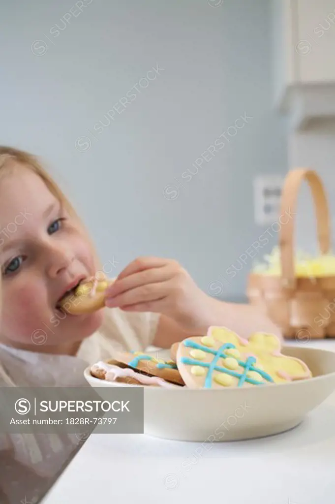 Little Girl Eating Easter Cookies