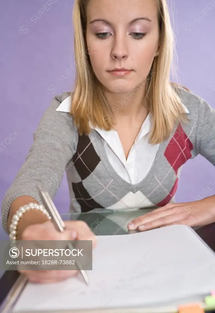 Woman Writing in Notebook