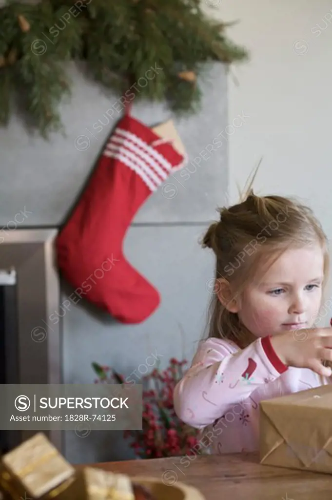Little Girl Opening Christmas Presents