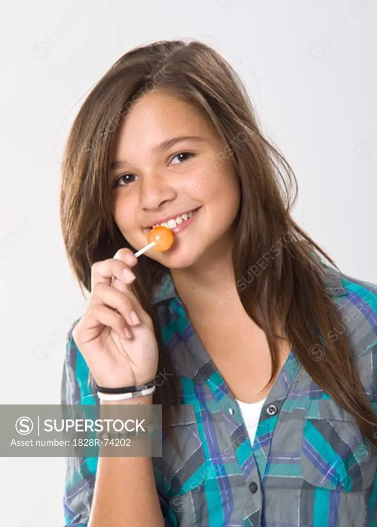 Girl Eating a Lollipop