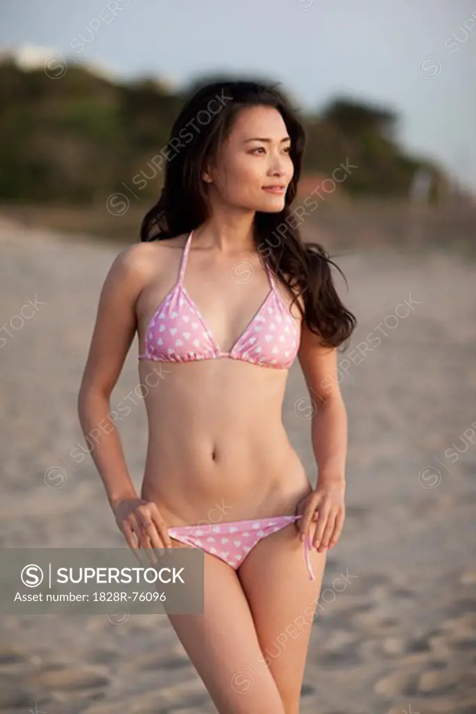 Portrait of Young Woman Standing on Beach, Zuma Beach, California, USA