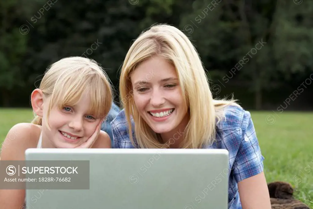 Mother and Daughter using Laptop