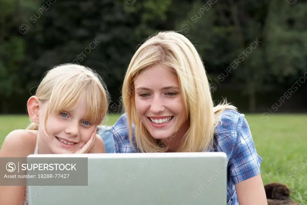 Mother and Daughter using Laptop