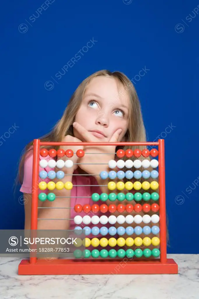 Young Girl Counting With Abacus