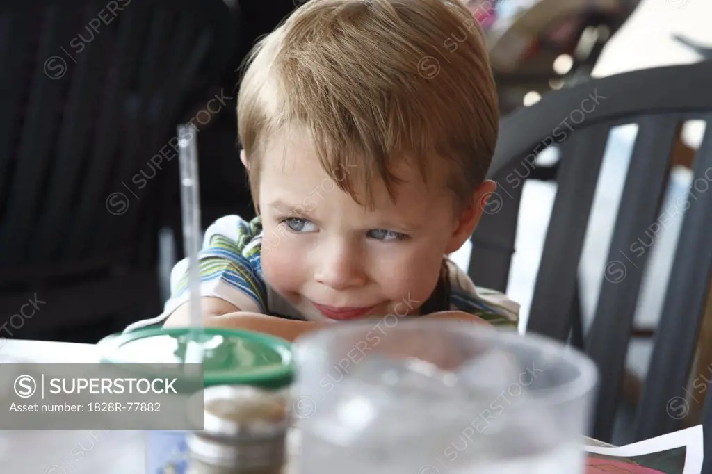 Boy Sitting at Table
