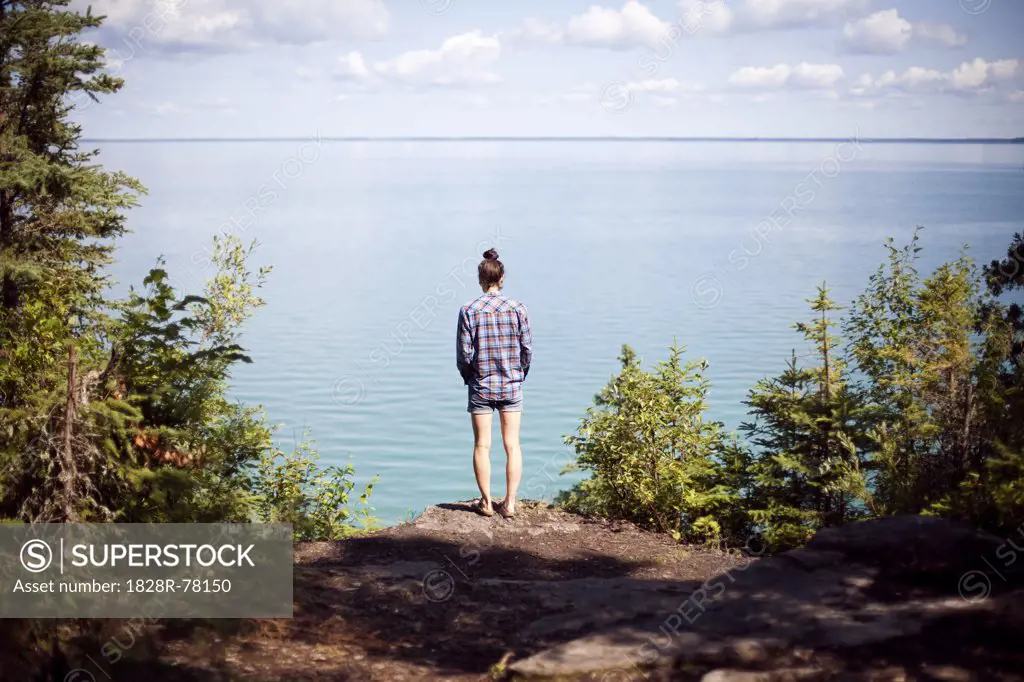 Woman Looking out at Clearwater Lake, Clearwater Lake Provincial Park, Manitoba, Canada