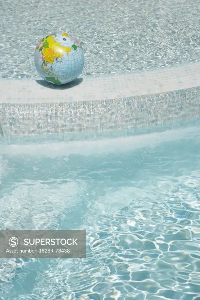 Beach Ball Globe in Swimming Pool, Sanary-sur-Mer, Var, Provence, Provence-Alpes-Cote d'Azur, France