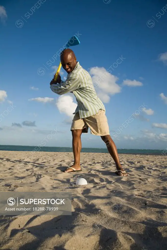 Man Playing Golf on the Beach, Florida, USA