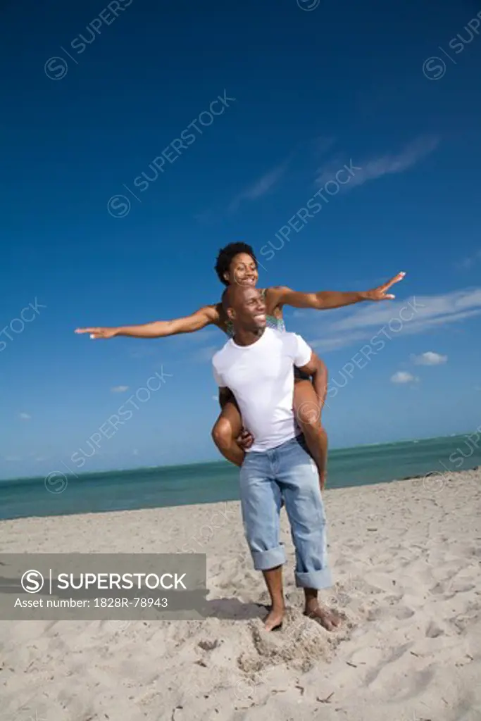 Couple Playing on the Beach, Florida, USA