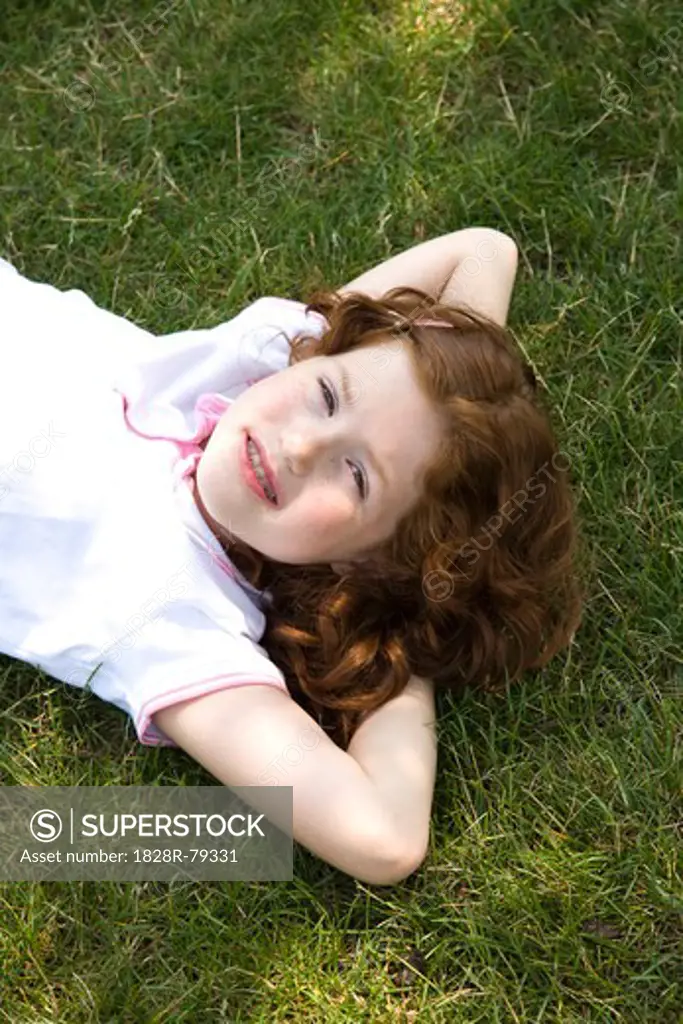 Little Girl Lying on the Grass