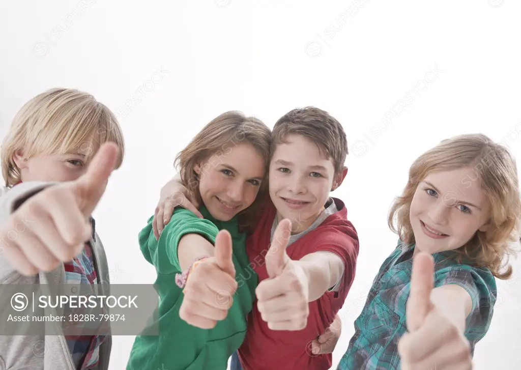 Teenagers giving Thumbs Up