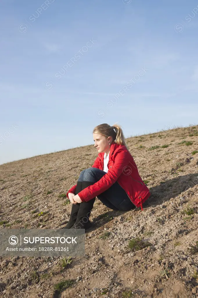 Teenager Sitting on Ground