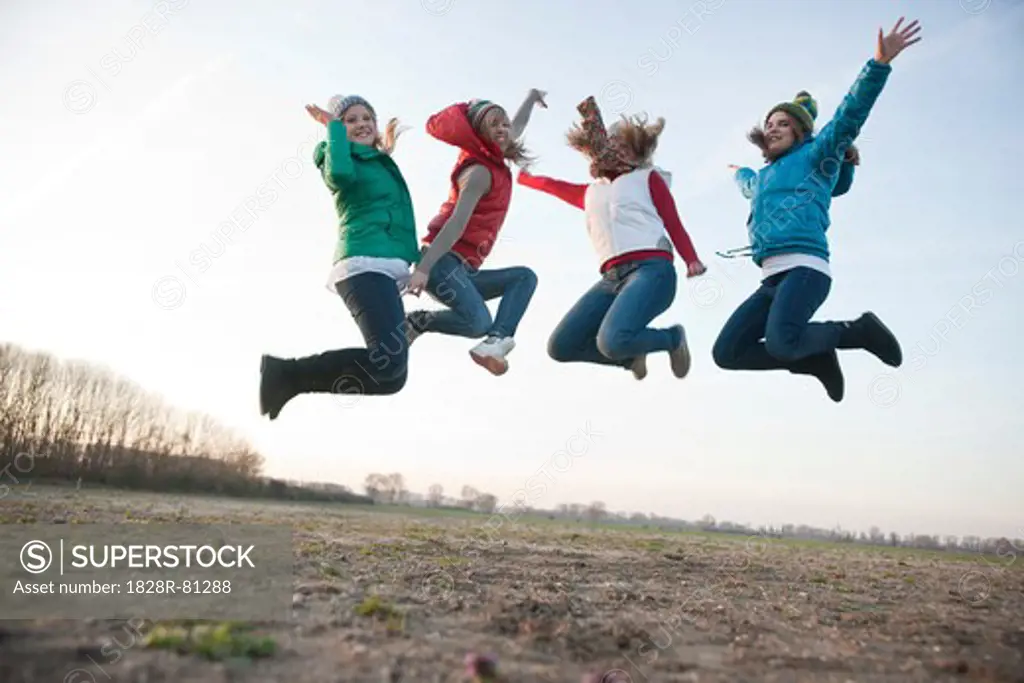 Teenagers Jumping in the Air